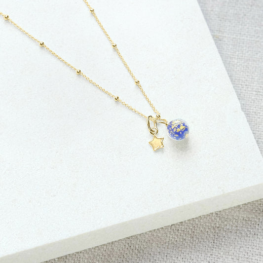 Blue bead necklace with star in gold